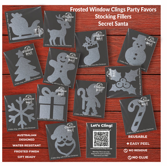 Collection of Creative Cling frosted window clings with Christmas designs on a red background